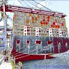 Ship photo shows the stern mooring lines of a big ship alongside in port